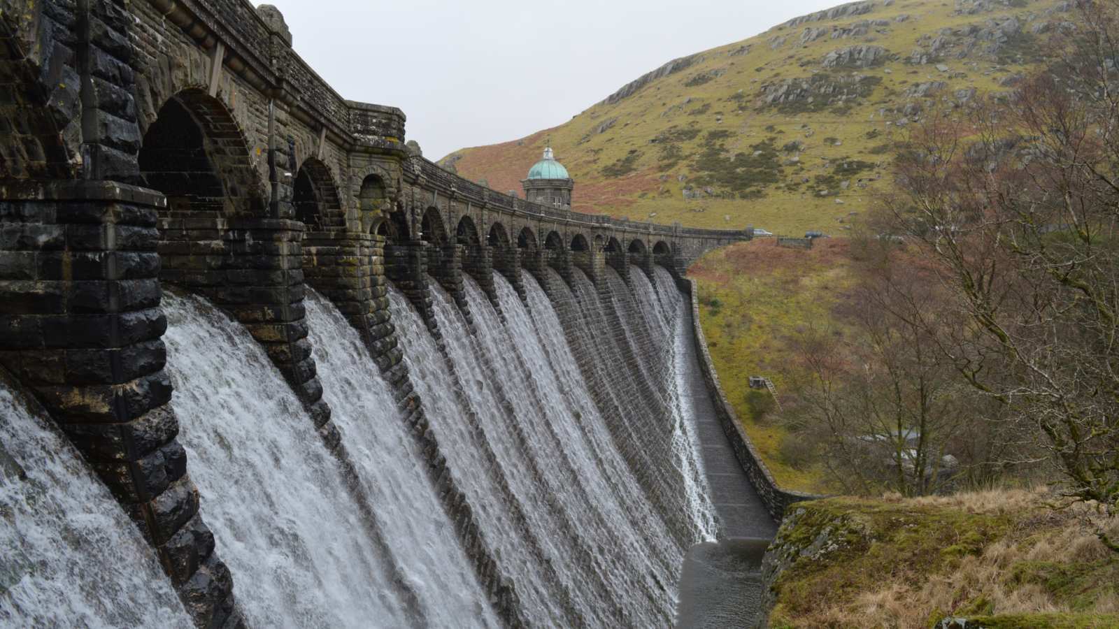 Water through the brick openings of Craig Goch Dam