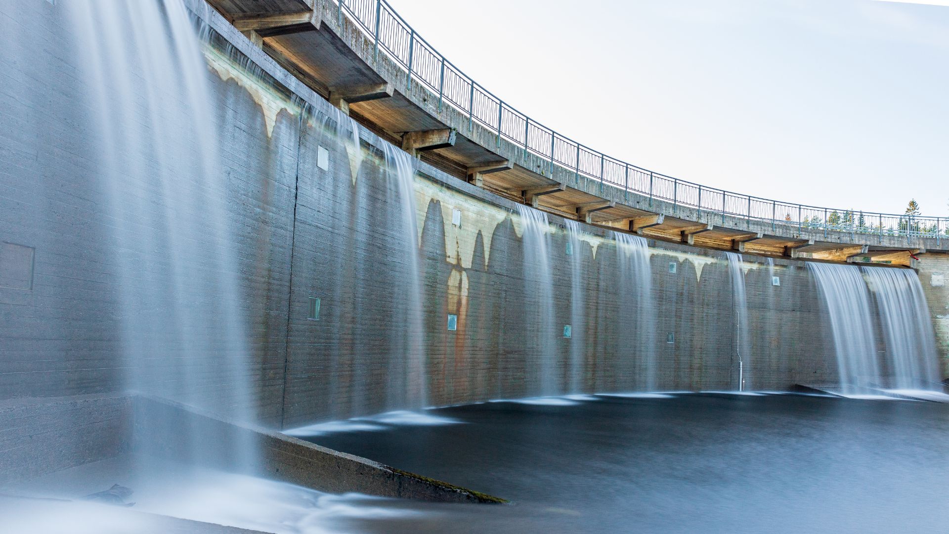 Water pours over a dam
