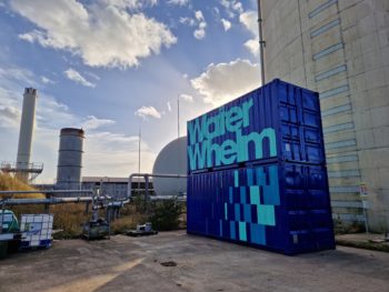 An image of two blue shipping containers stacked on top of each other, which are Waterwhelm's pilot plant for water reuse.