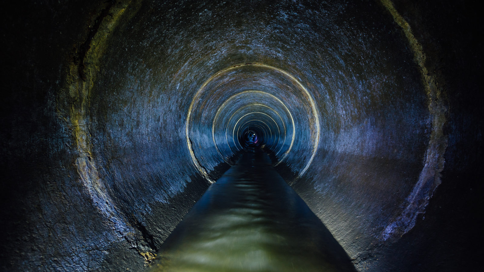 Dark,Underground,Sewer,Round,Concrete,Tunnel.,Industrial,Wastewater,And,Urban