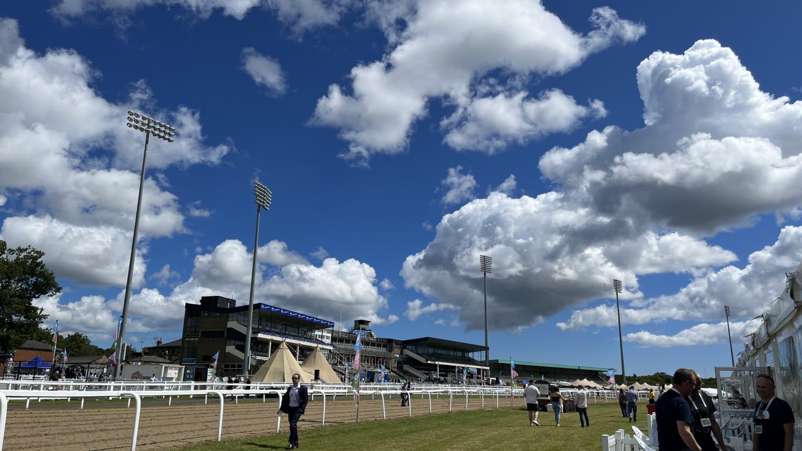 Image of the track at Newcastle Racecourse during the Northumbrian Innovation Festival on a cloudy day with blue skies